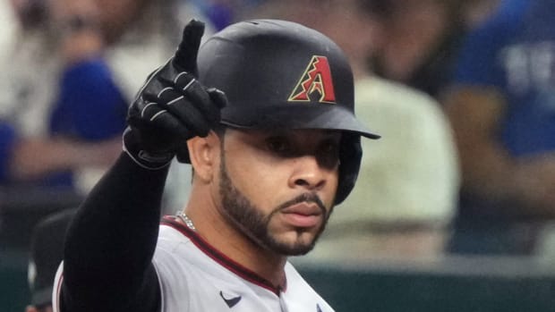 Diamondbacks outfielder Tommy Pham reacts after hitting a single.